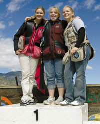 Homeschooler Kate B. shares the winners' podium with friends.